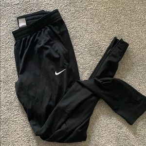 Nike womens track pants! Zip leg and size S